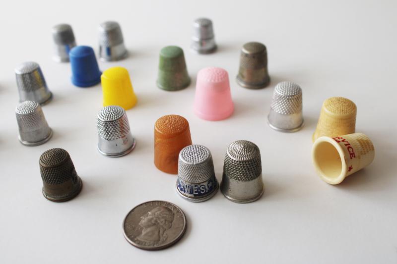 lot of vintage sewing thimbles, some old advertising pieces, metal & plastic