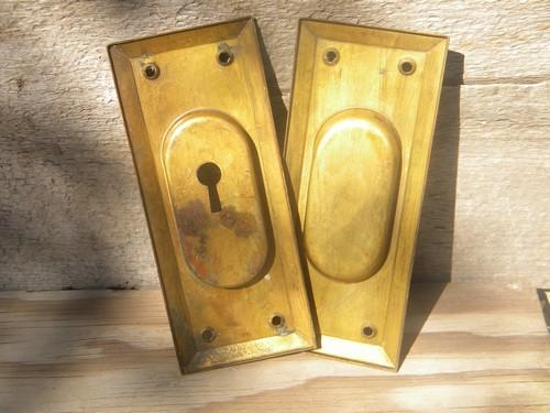 mid-century brass pocket door pulls vintage architectural hardware
