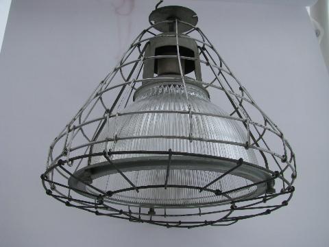 mid-century industrial machine-age vintage Holophane ceiling light with glass shade and wire cage