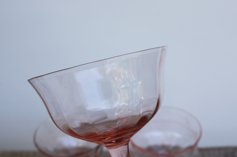 mismatched pink glass sherbet dishes or champagne glasses, vintage glassware