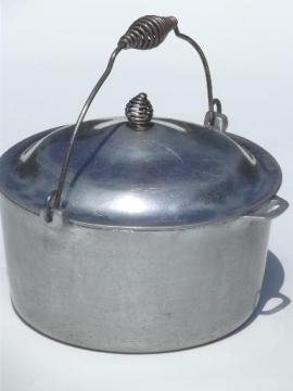 old Majestic cast aluminum dutch oven w/ spun wire handles for wood stove