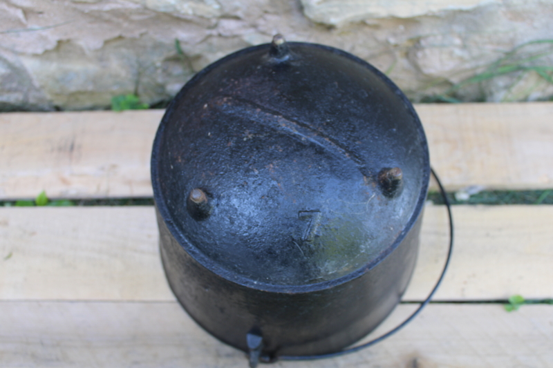 old antique cast iron kettle, three legged cooking pot witchs cauldron w/ handle
