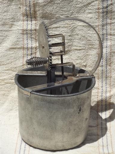 old antique egg beater, tinned steel bowl and hand-crank whipper beaters