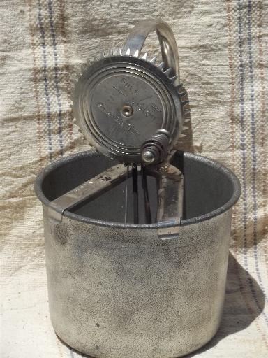 old antique egg beater, tinned steel bowl and hand-crank whipper beaters