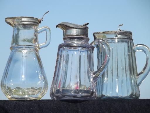 old antique glass syrup jugs lot, lidded pitchers 1914 and 1915 vintage