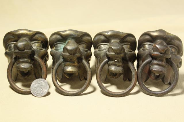 old cast metal gargoyle lion heads, vintage ornamental hardware for clock, fireplace or furniture