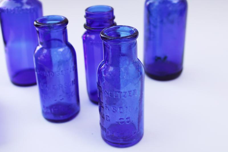 old cobalt blue glass medicine bottles, embossed Bromo-Seltzer, vintage Milk of Magnesia