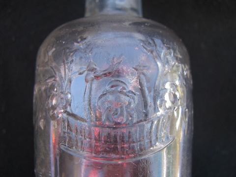 old embossed glass medicine or perfume bottle, E D Pinaud - Paris