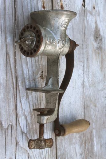 Lot - Antique hand crank food chopper and cast iron figural lion embossed  seal press.