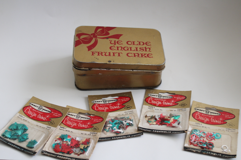 old fruitcake tin w/ packages of sequins for Christmas decorations or beaded ornaments