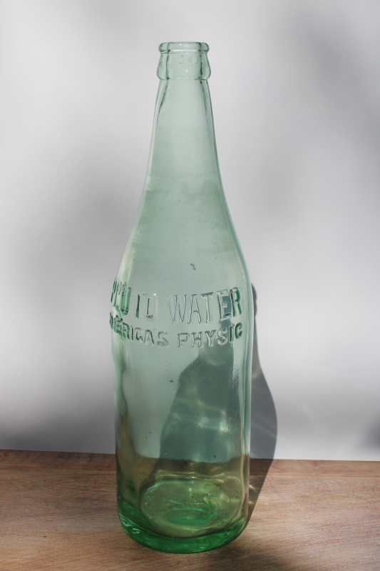 https://laurelleaffarm.com/item-photos/old-green-glass-bottle-embossed-devil-Pluto-tonic-water-vintage-quack-medicine-Laurel-Leaf-Farm-item-no-rg061939-1.jpg