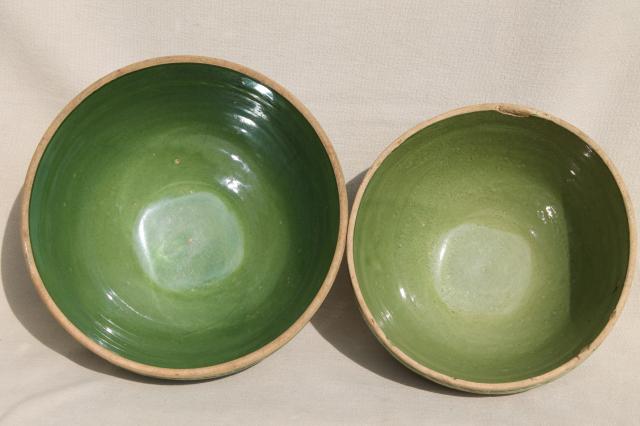 old green glaze yellow ware pottery mixing bowls, pine branch pattern stoneware bowl nest