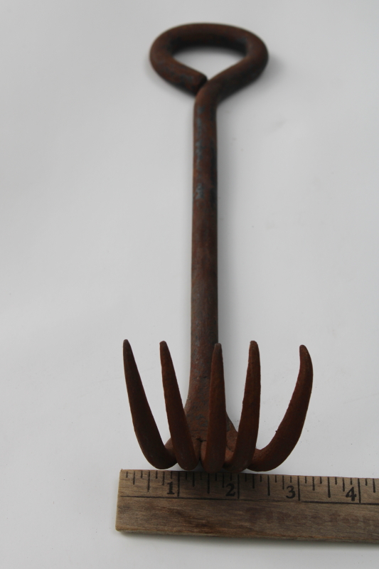 old hand forged iron rake, heavy claw for fireplace or wood stove, primitive vintage hand tool