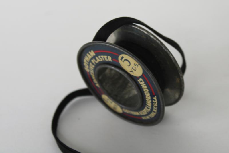old metal spool from Gotham Labs sticking plaster bandage roll, vintage medical advertising