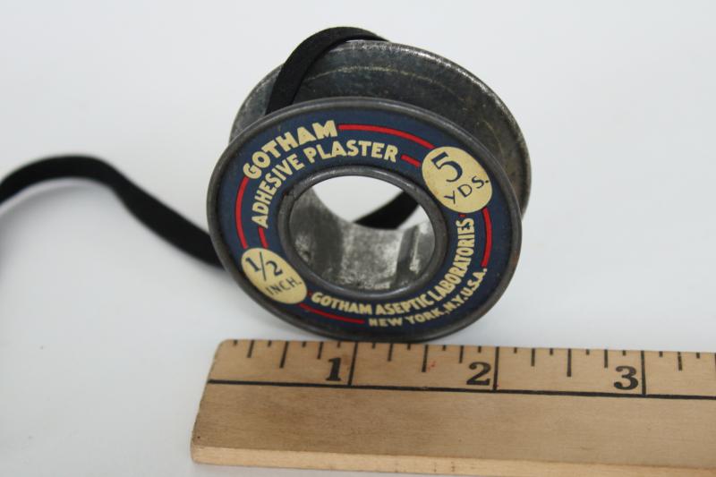 old metal spool from Gotham Labs sticking plaster bandage roll, vintage medical advertising
