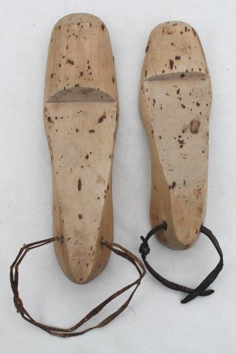 old wooden feet, foot shaped wood blocks to form shoes or slippers ...