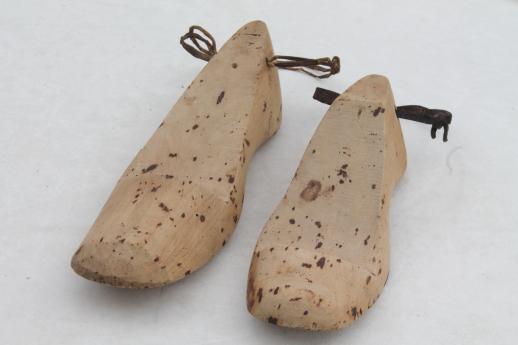 old wooden feet, foot shaped wood blocks to form shoes or slippers ...