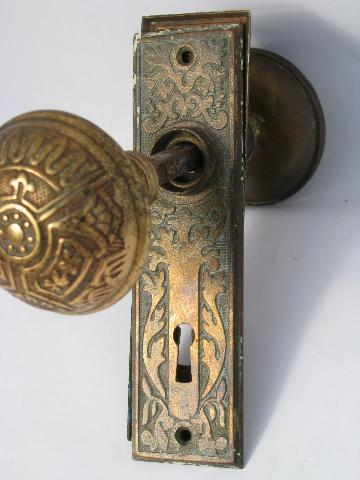 ornate antique Arts and Crafts brass door hardware, doorknobs & plates