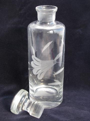 pair glass decanter bottles w/ ground stoppers, etched trumpet flowers