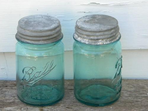 pair of antique Ball Mason 1 pint blue glass canning jars w/zinc lids