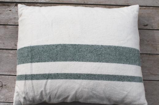 pair of vintage feather pillows w/ old wool camp blanket fabric covers 