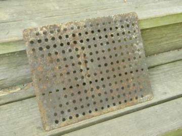 primitive antique cast iron floor grating or industrial drain cover