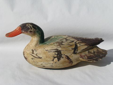 primitive hand-carved wood folk art painted duck decoys for cabin or lodge