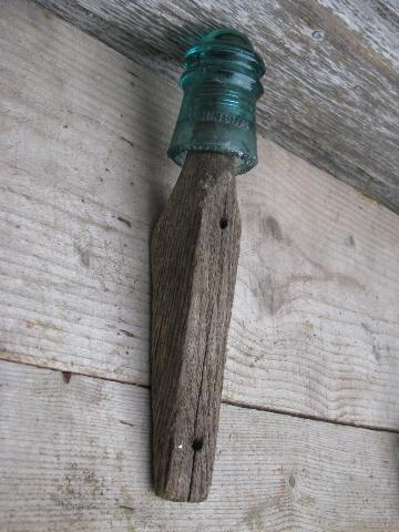 primitive harrness or coat hooks, old barn board wood pegs w/ antique glass insulators
