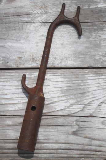 primitive iron tobacco pole, rusty iron farm tool for handling drying tobacco 