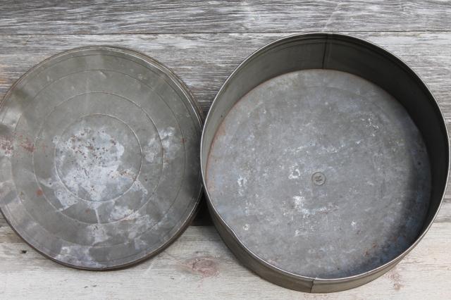 primitive old antique metal cracker box or cake tin, large round hatbox shape
