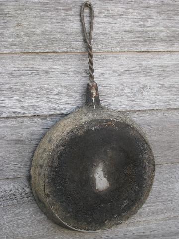 primitive old campfire or wood stove frying pan, skillet w/ wirework handle