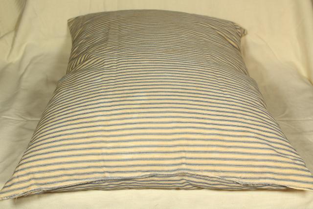 primitive old chicken feather pillow in vintage indigo blue cotton ticking fabric
