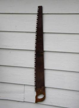 primitive old crosscut saw lumberjack tool north woods cabin or lodge