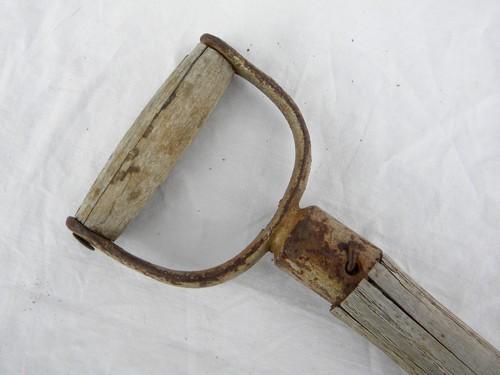 primitive old garden tool, a small shovel or spade