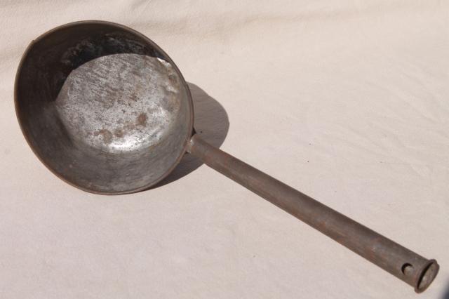 primitive old tin metal dipper, big soup ladle or water pail drinking cup