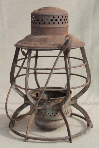 primitive rusty old railroad lantern, old iron lamp cage without glass shade