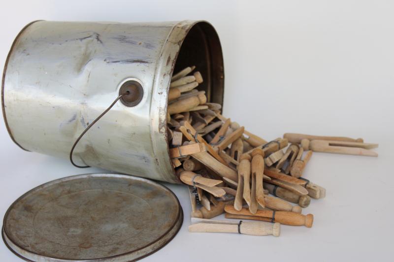 primitive tin bucket full of vintage hard wood clothespins, rustic farmhouse decor