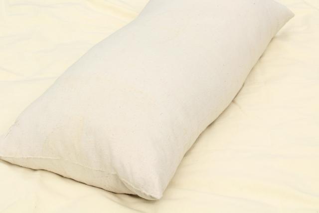 primitive vintage feather pillow, long heavy bolster in homespun cotton grainsack 