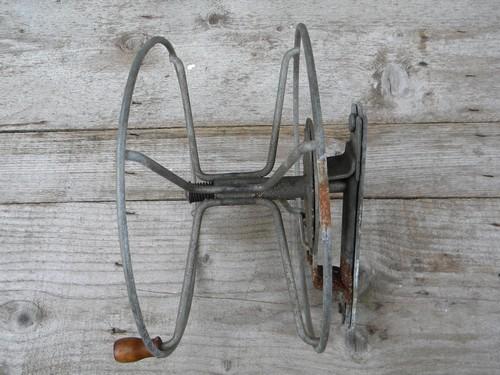 primitive vintage wire winding reel for garden hose, laundry line, rope