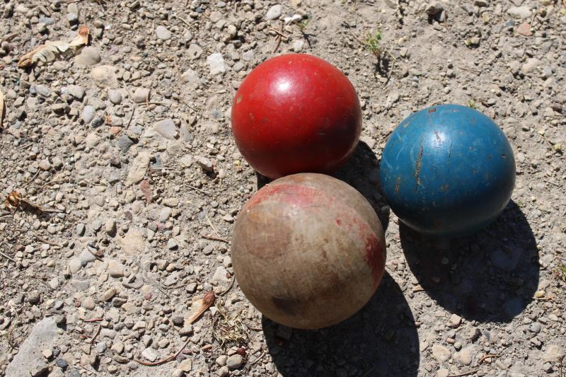 primitive vintage wooden croquet balls, natural wood and worn red & blue paint
