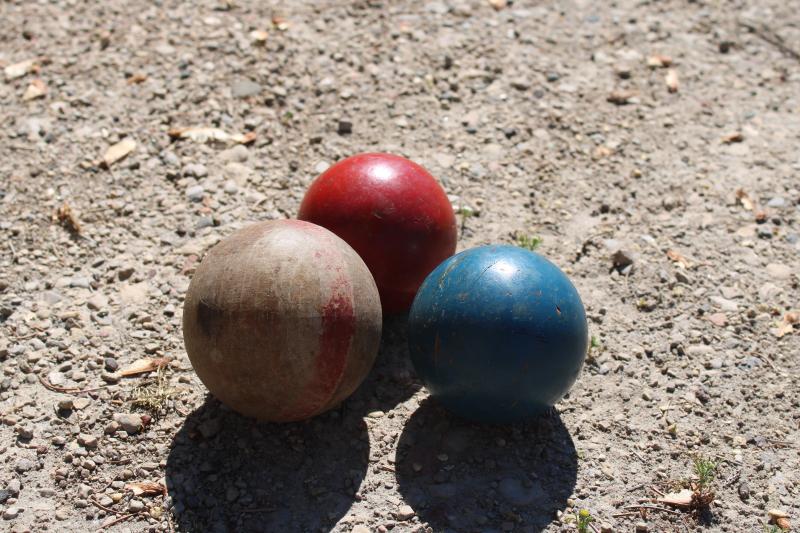 primitive vintage wooden croquet balls, natural wood and worn red & blue paint