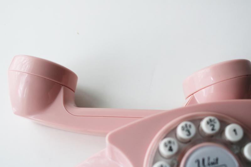 retro style pink princess phone, touch tone 2015 Crosley remake of vintage telephone
