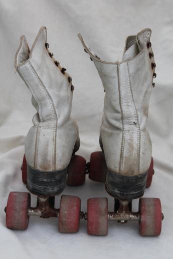 retro vintage roller skates w/ leather boots, very rough, great garden flower planters!