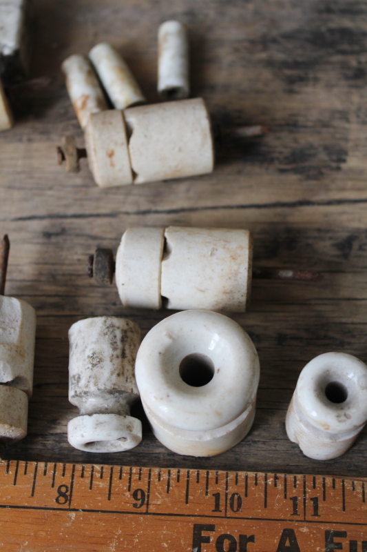 rough old porcelain insulators from antique electrical wiring, vintage architectural salvage