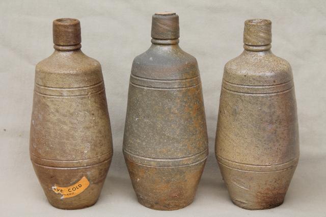 rustic old French country wine label stoneware bottles, vintage Portugal pottery
