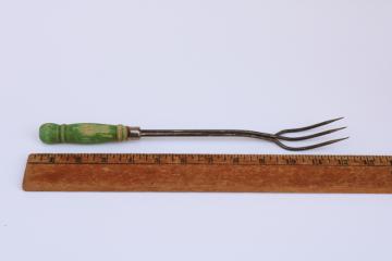 rustic vintage toasting fork or campfire marshmallow toaster, old green paint wood handle