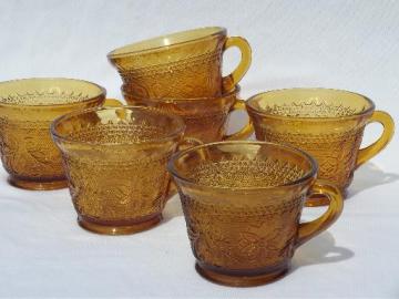 set 6 footed cups, vintage Tiara amber glass sandwich daisy pattern