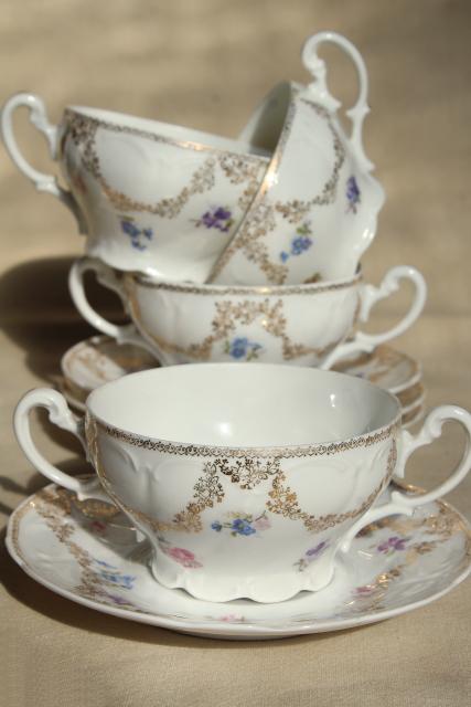 set of antique German bullion or cream soup bowls, double handled china cups w/ saucers