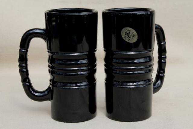set of four opaque black glass mugs or steins w/ vintage Tiara glass labels