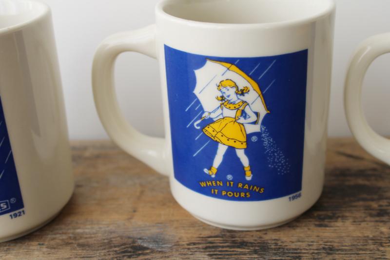 set of vintage china coffee mugs, Morton salt girl 1914 - 1921 - 1956 - 1968 ad graphics